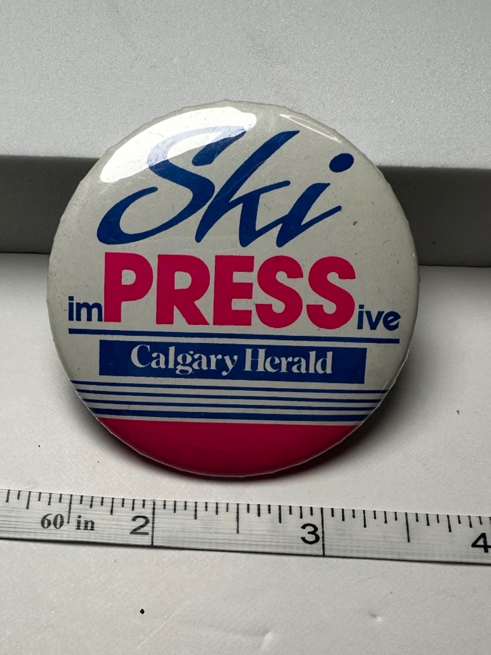 Vintage Calgary Herald Ski imPRESSive Pinback Button 1980s Alberta Canada
